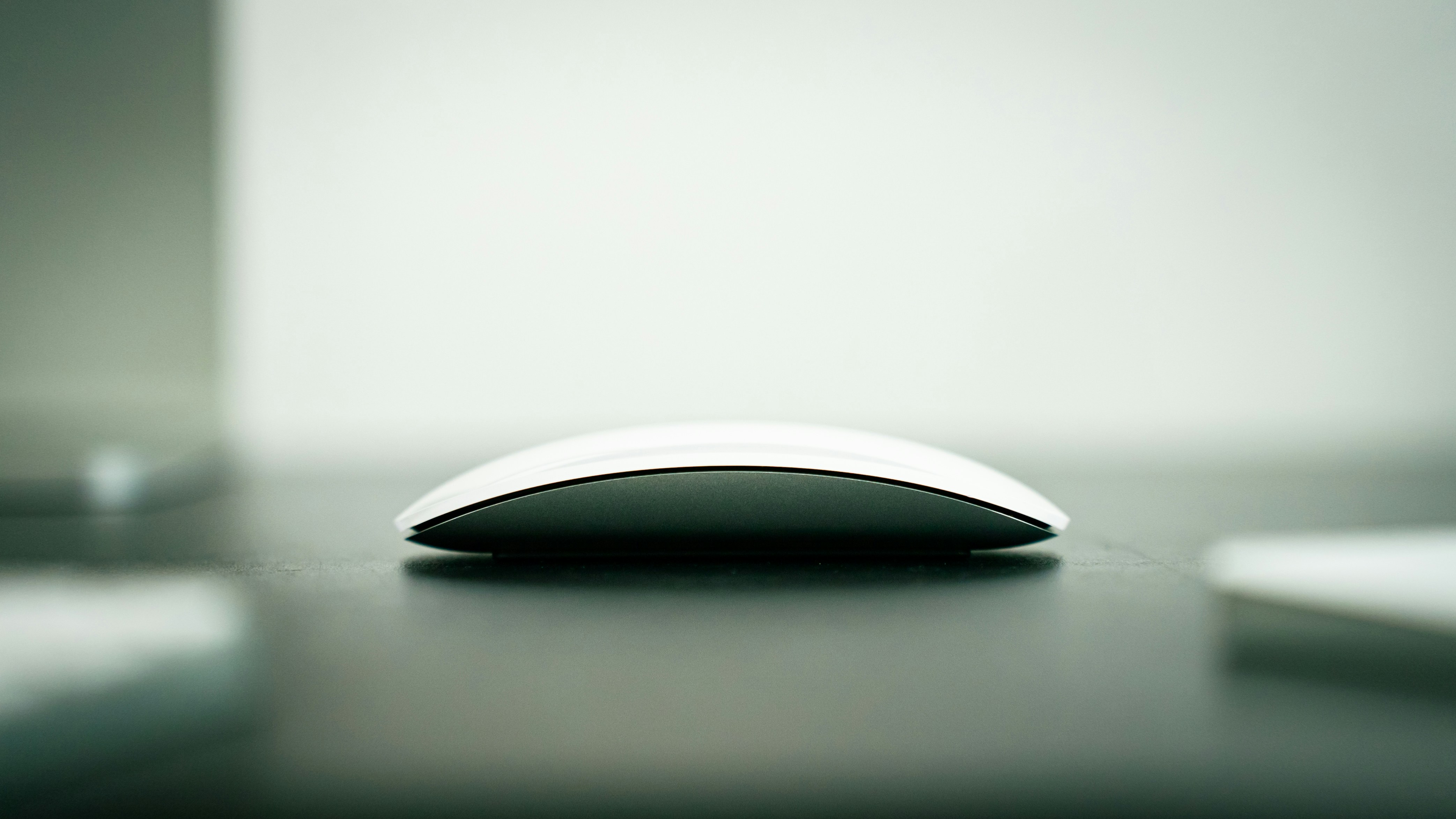 Apple Magic Mouse with USB-C in a minimalist desk setting