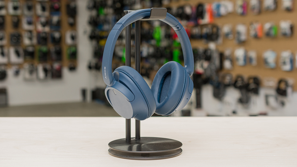 Sony WH-CH720N wireless over-ear headphones on a display stand