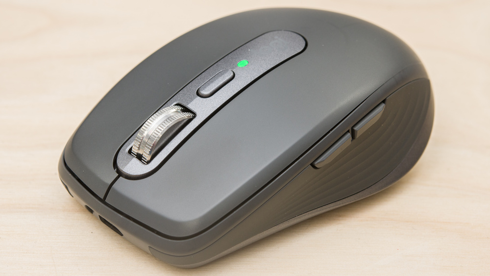 Logitech MX Anywhere 3S wireless mouse on a light desk